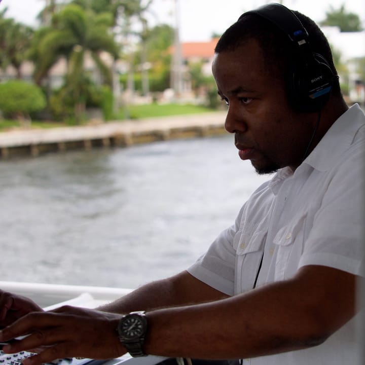 Carlo Smith, Music Mixology DJ, at the mixer during a yacht party